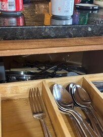 Back of the silverware drawer was missing and all the silverware fell out and down one night
