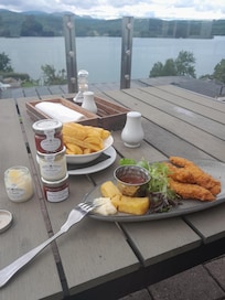 Having snack on balcony overlooking lake