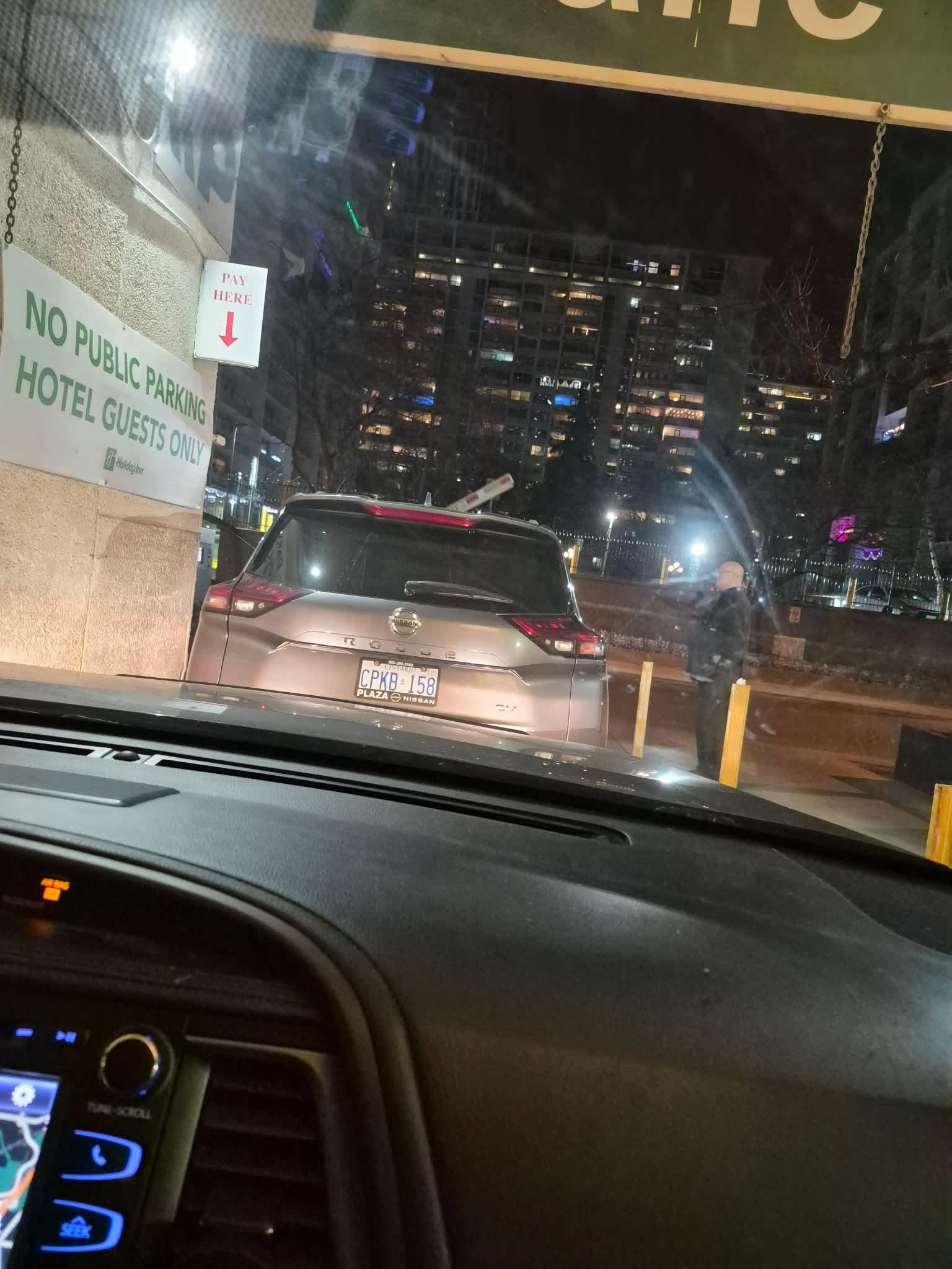 Car parked at exit way in front of parking garage and turned off owner missing 