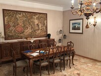Dining room with sitting area and fire place.