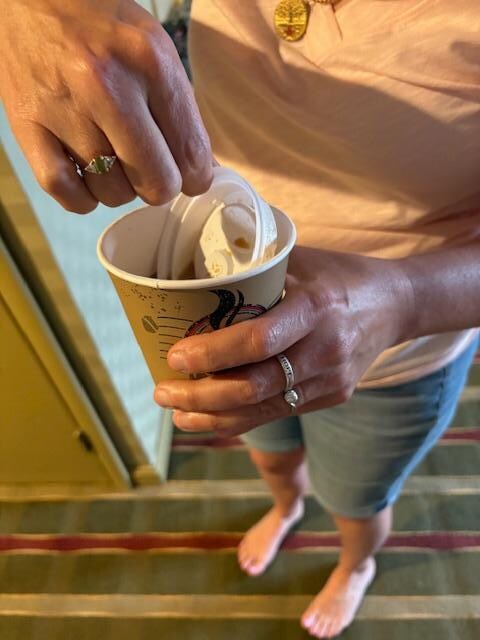 Lid goes right into cup.  Maybe they should check ttem before they are given out!