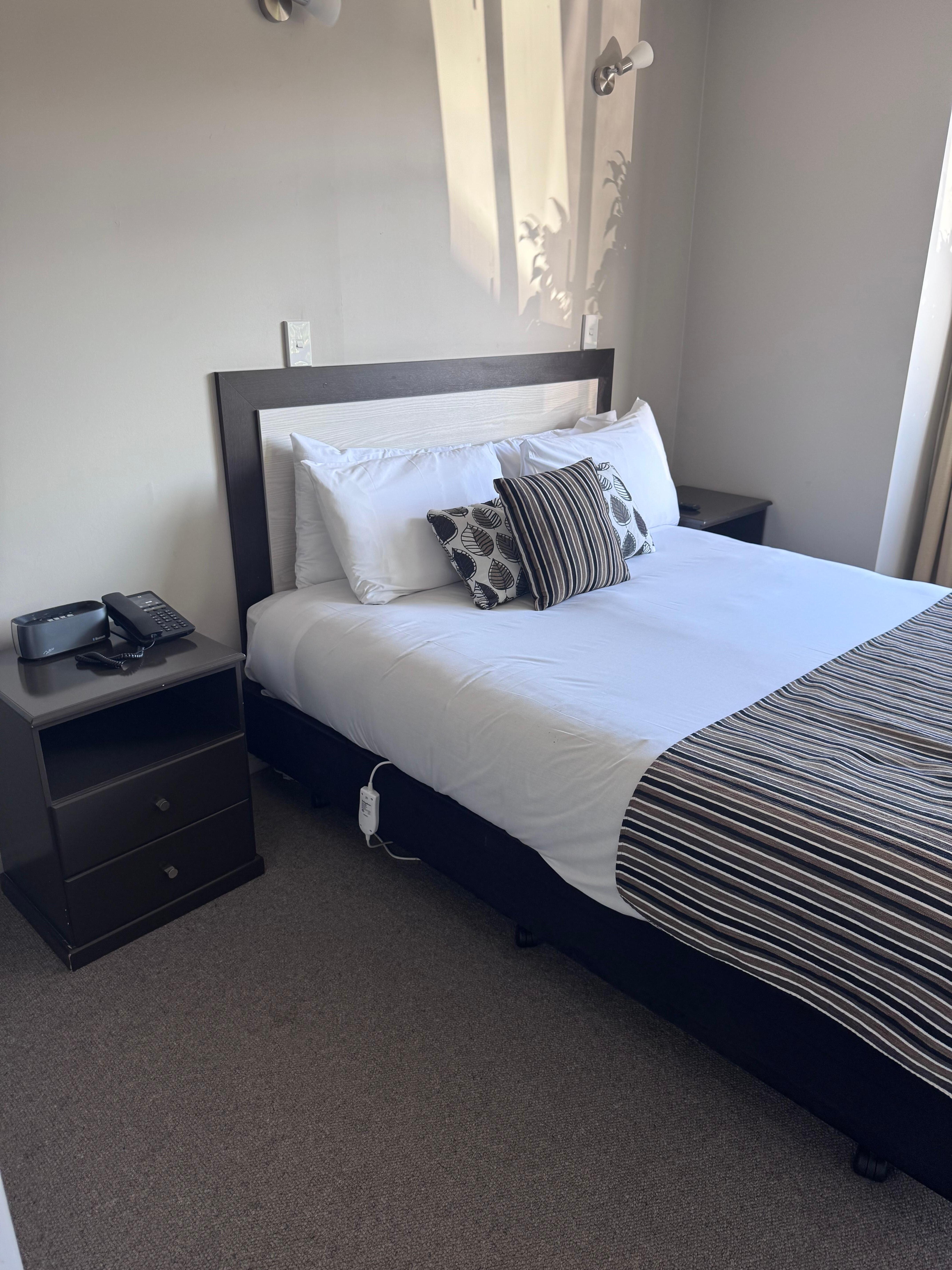 Main bedroom 
Has a wardrobe 
Full length mirror on the wall 
TV on the wall 