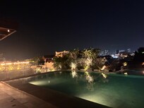 The rooftop pool at night.