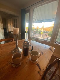 Table is the perfect spot to sit and have coffee. She had a French press!