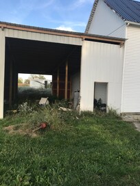 Barn full of trash next to the kitchen door.