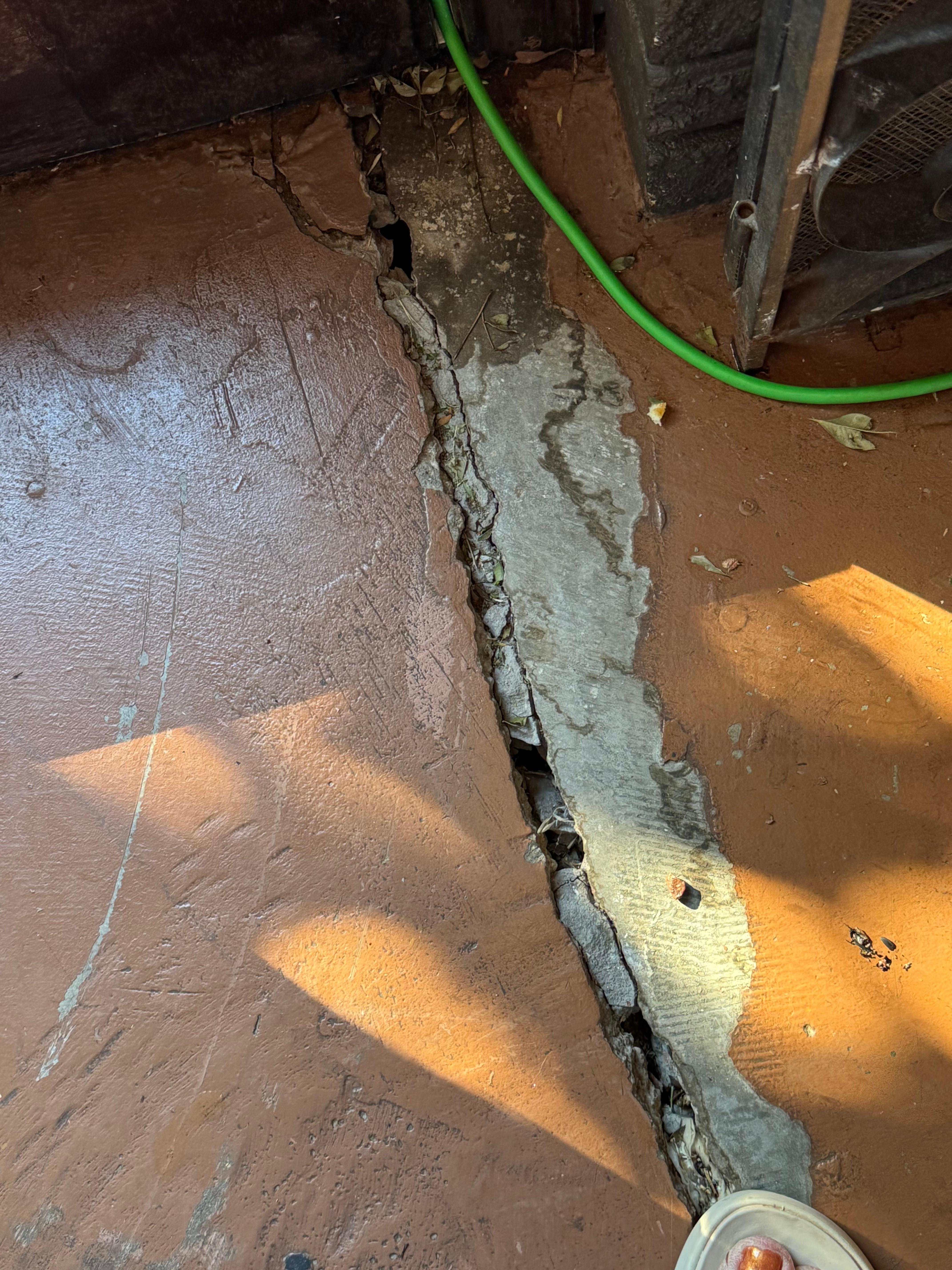 Large cracks in back room. Property has not been maintained. 