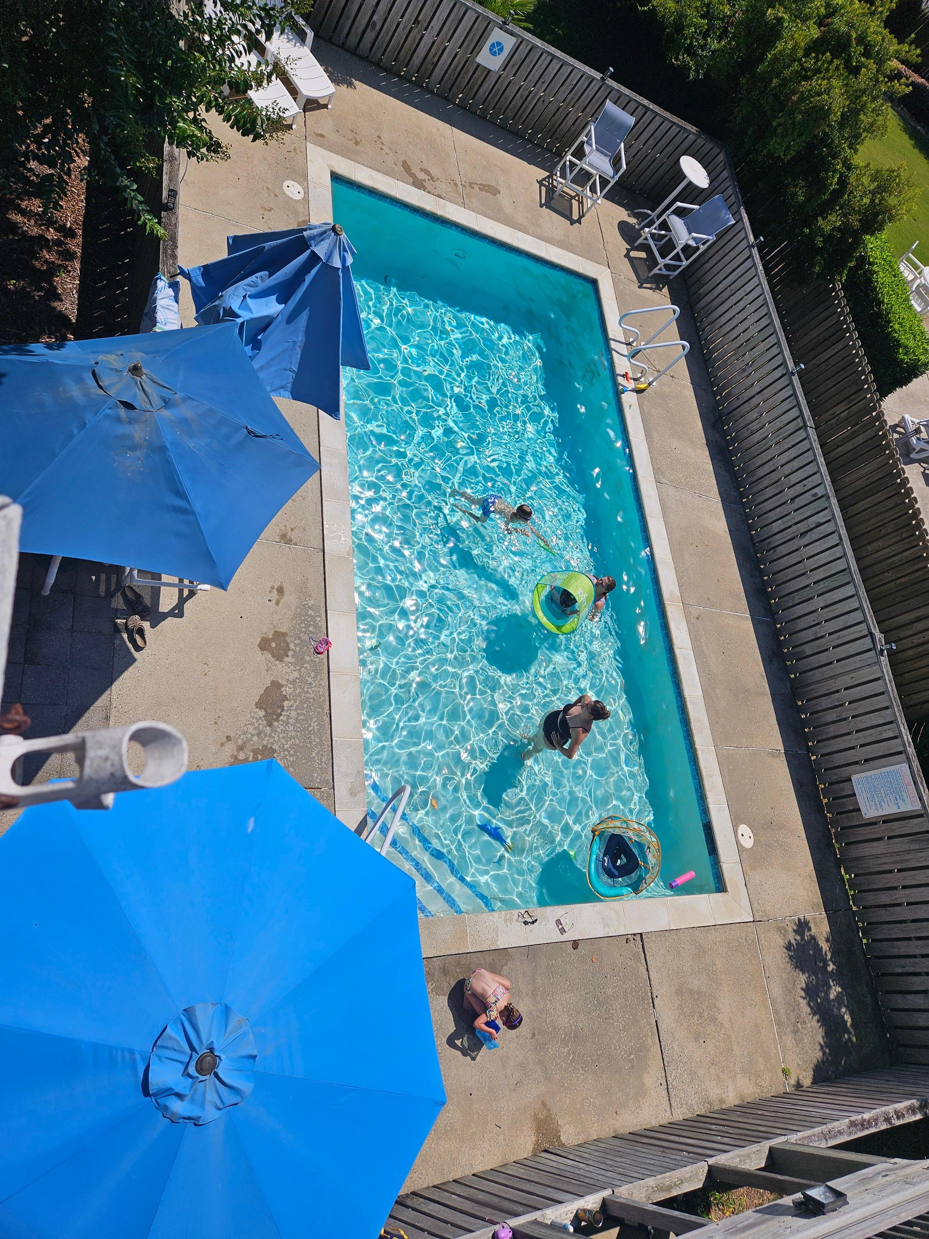 Some the family poolside, pic from top floor balcony!
