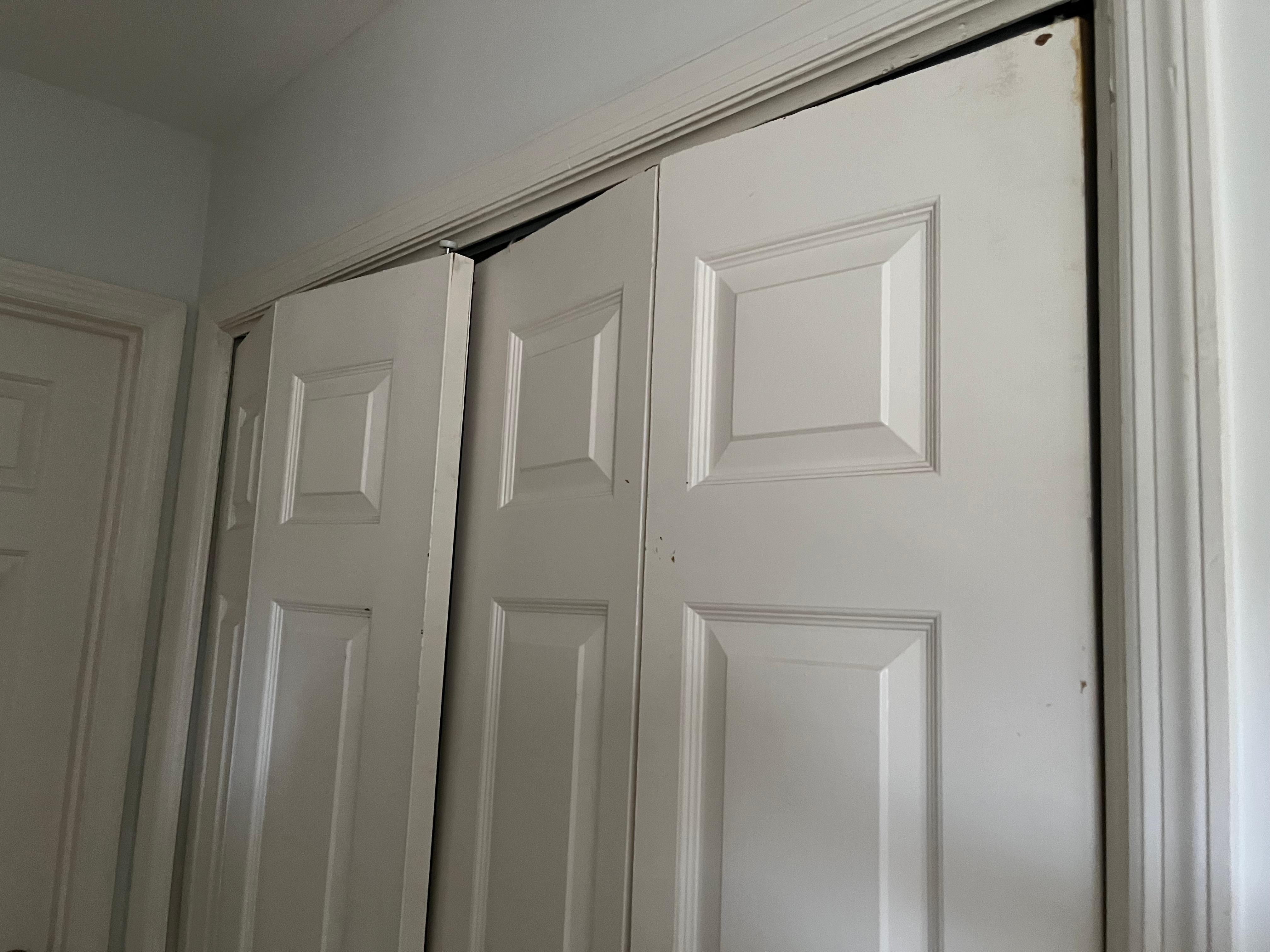 Accordion doors are completely off the track and inoperable in the laundry area.