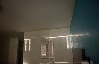 The light is so strong through the blinds, this is the other side of the wall. Taken at night