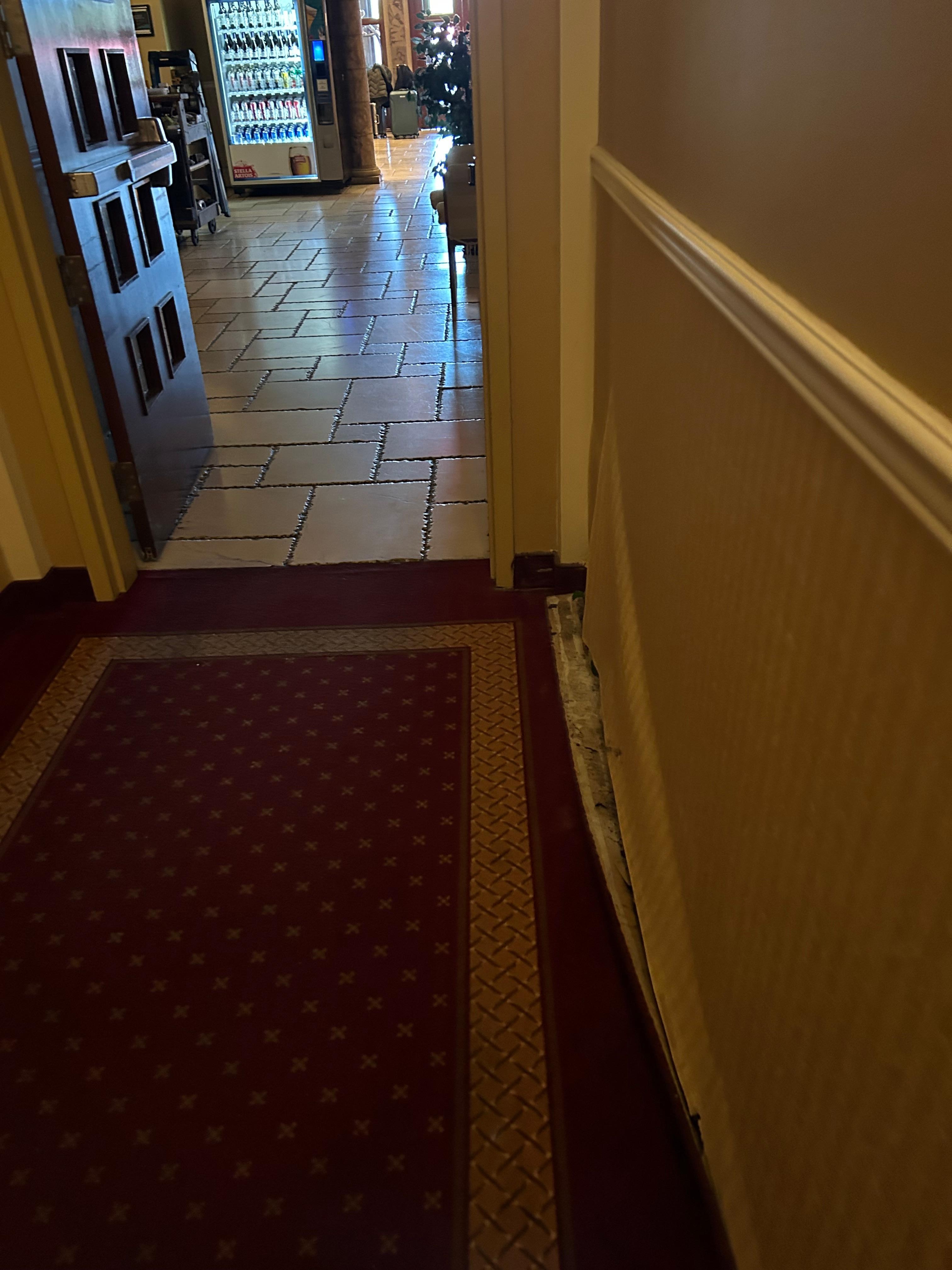 Hall wall, wallpaper detached from wall.