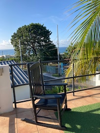 Glimpse of the ocean from the roof of the pavilion by the pool