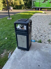 Outside garbage cans for 2 days in a row.