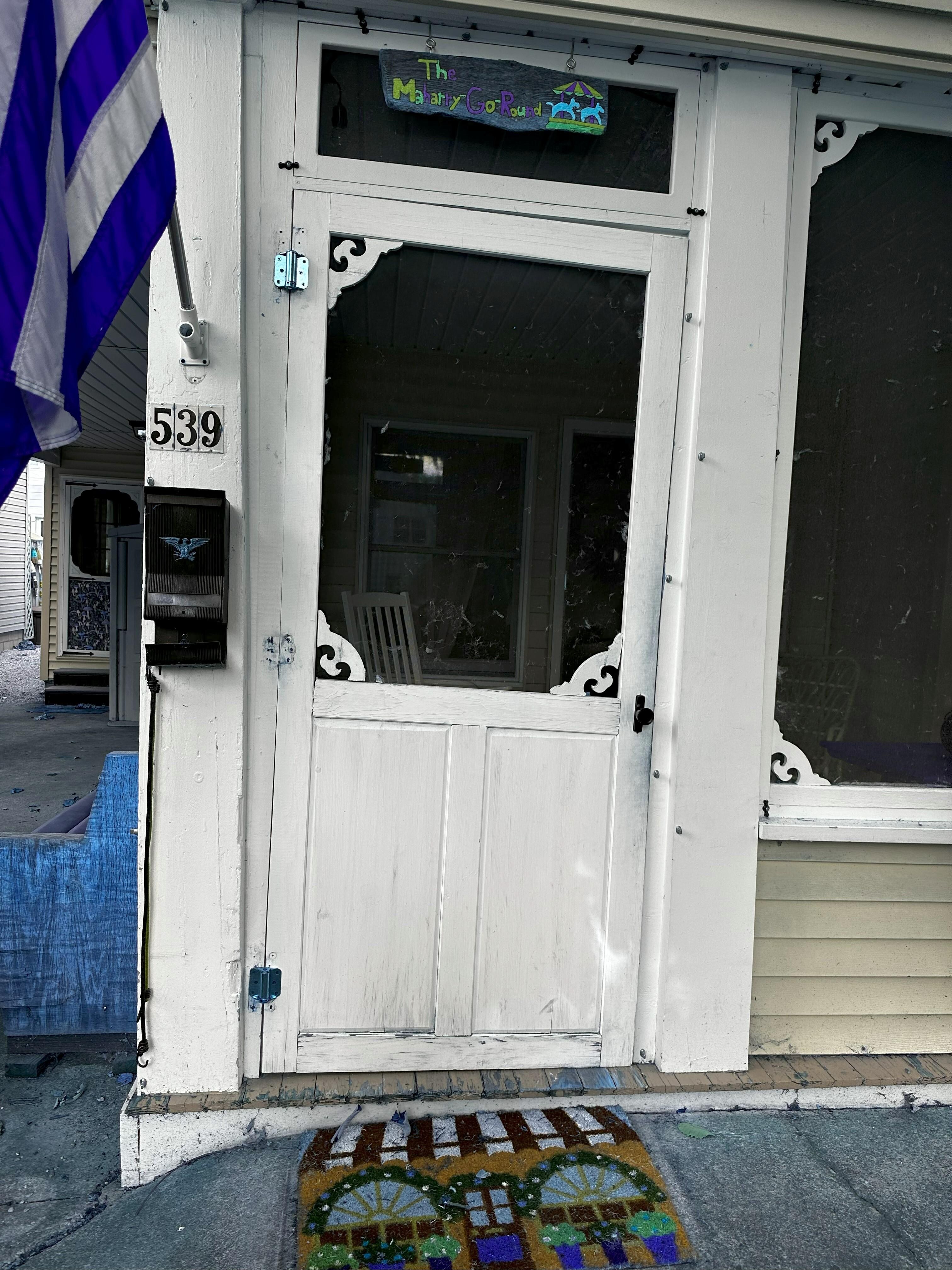 Missing a side hinge on top; off kilter door