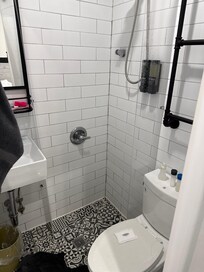 Cramped shower we did not pay to have