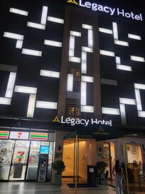 Front entrance. 7/11 and restaurant first floor.