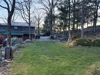 This is the area to the right of your staying area facing the neighbor.