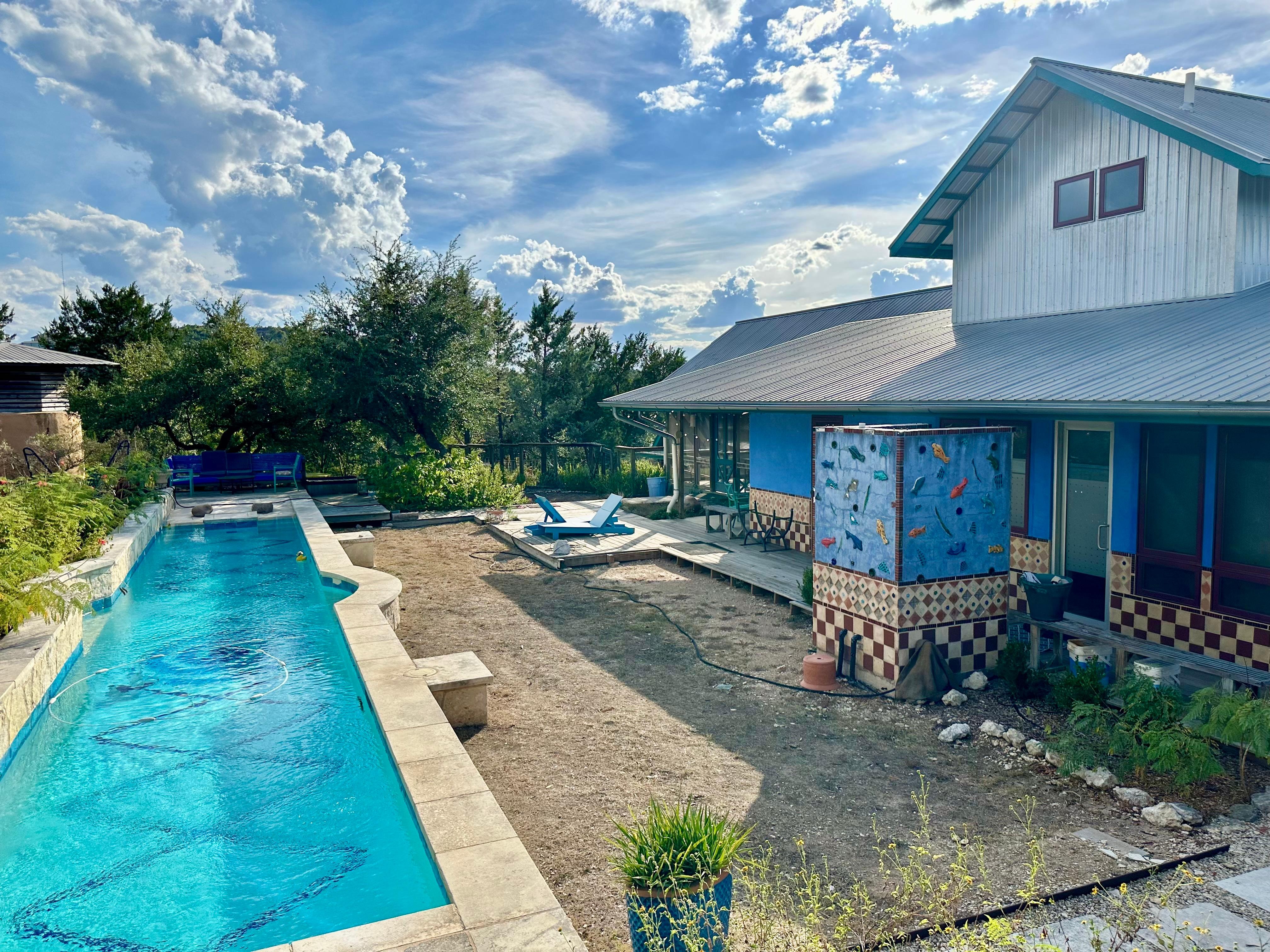Pool, Outdoor Shower and Large Building on the Compound