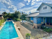 Pool, Outdoor Shower and Large Building on the Compound