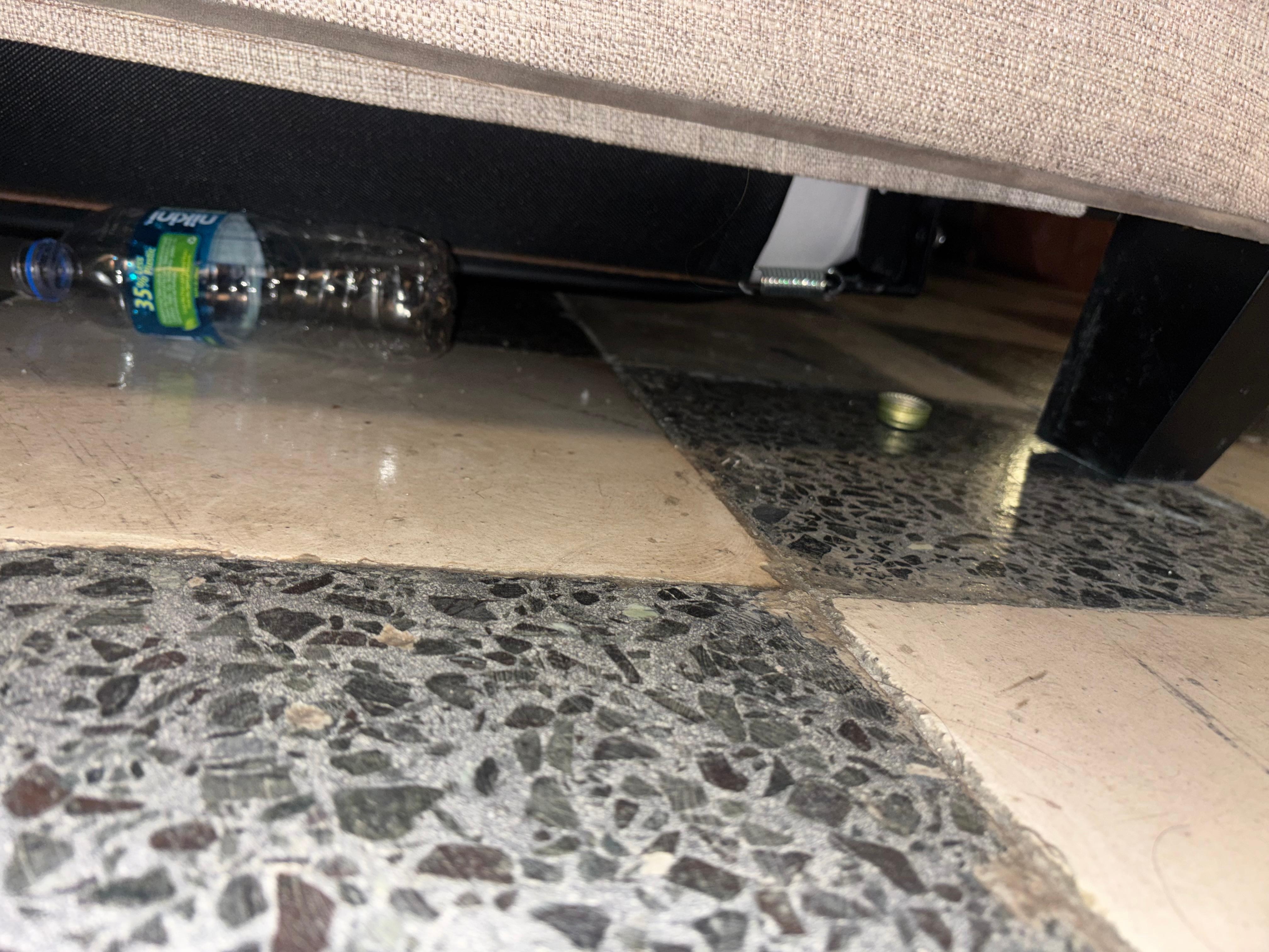 Trash under couch upon arrival 