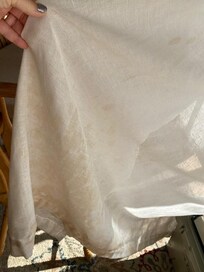 Filthy curtains, looks like urine.