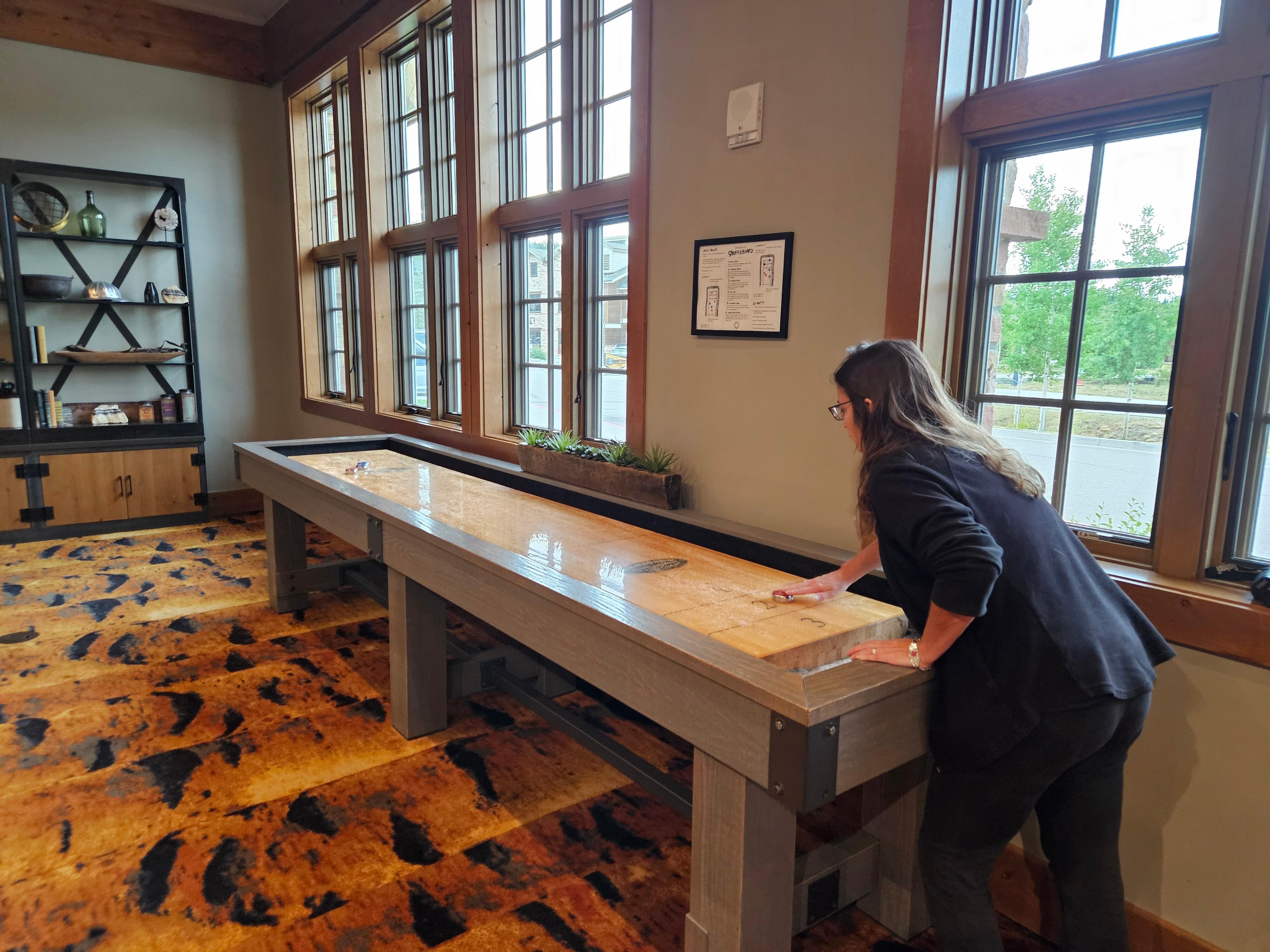 My wife kicking my butt at shuffle board