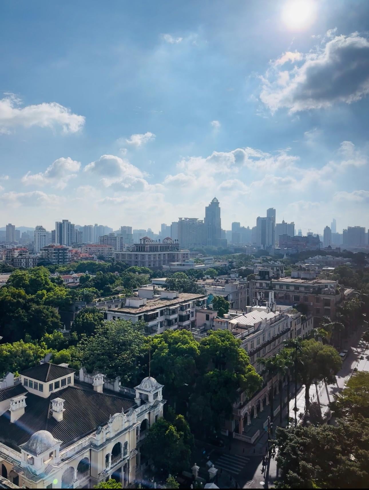 The urban scenery visible from the room's window