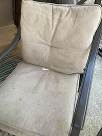 One of the 6 stained and grubby outside dining chairs.