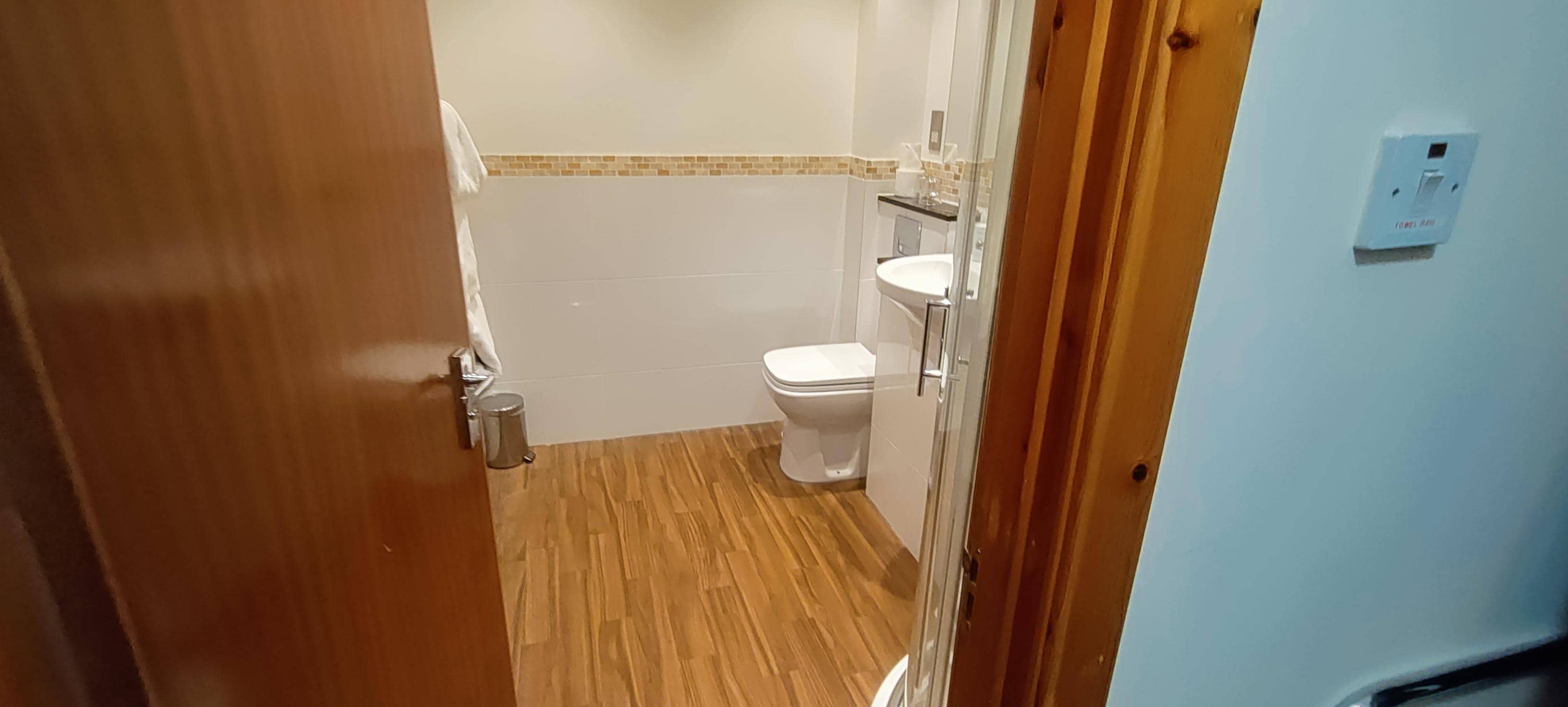 Bathroom with a shower in the corner (out of frame)