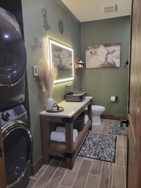 Full size laundry, lighted mirror & heated floors