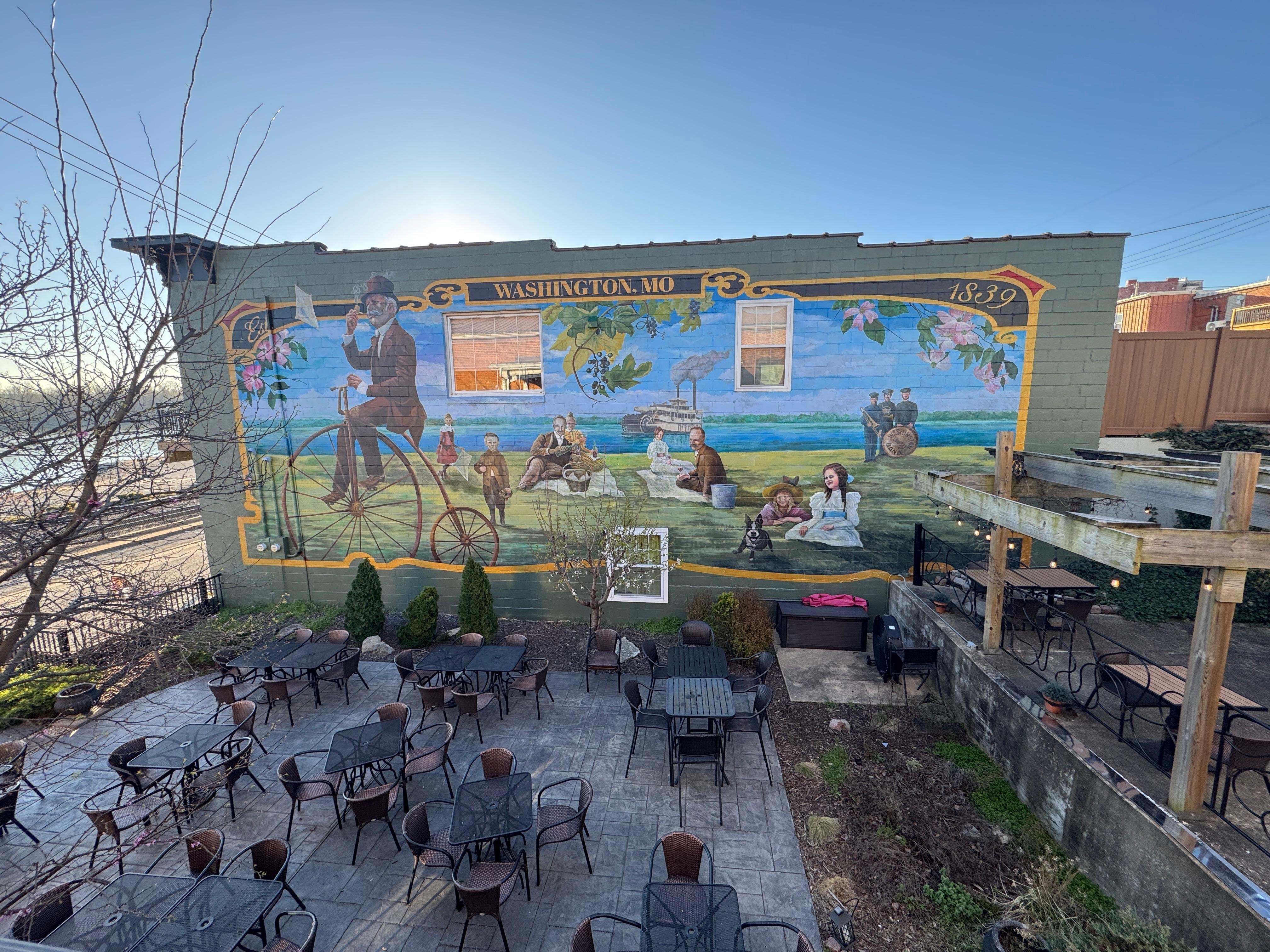 View of the side deck over looking a restaurant. 