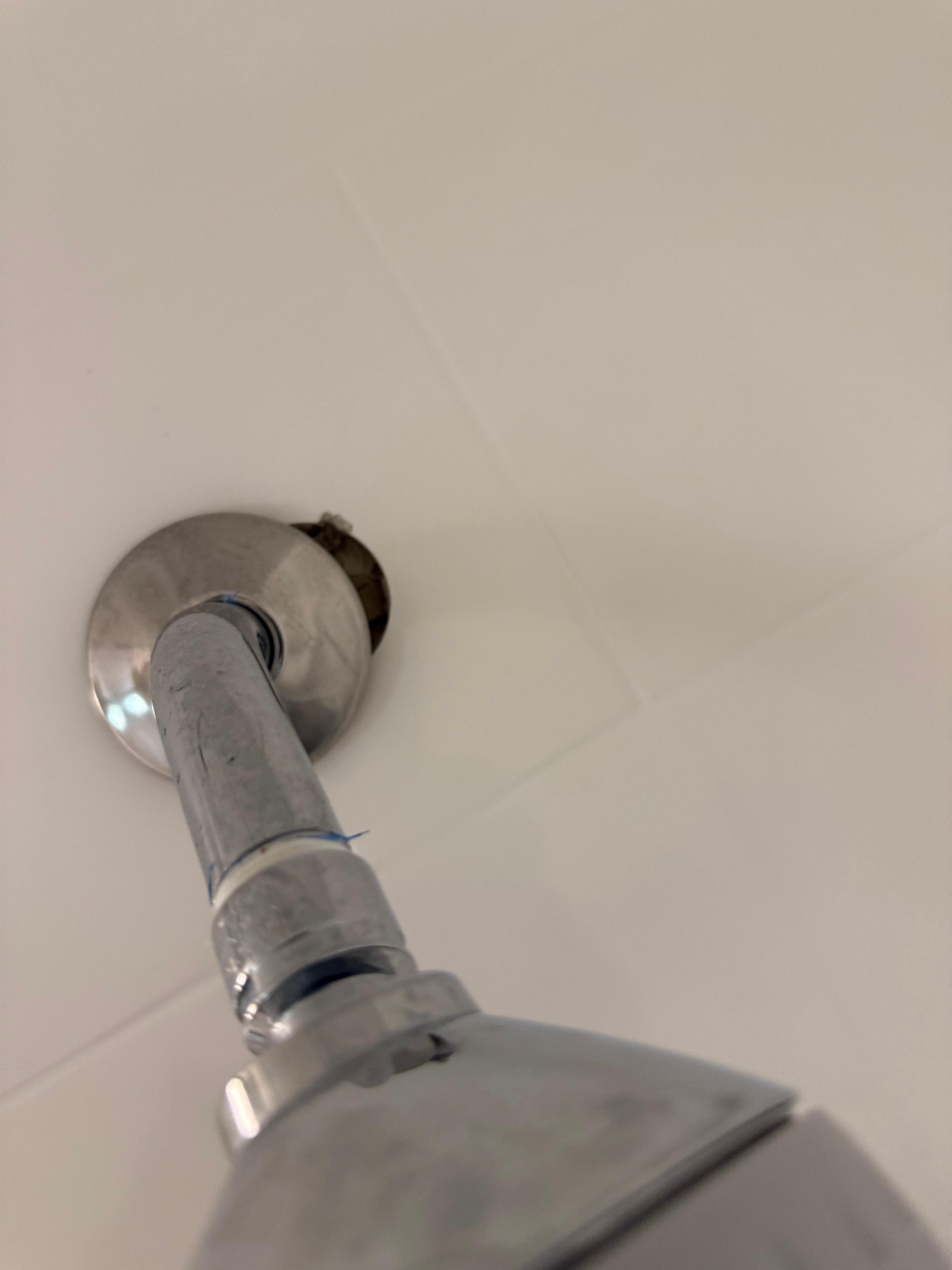 Shower head lost on wall