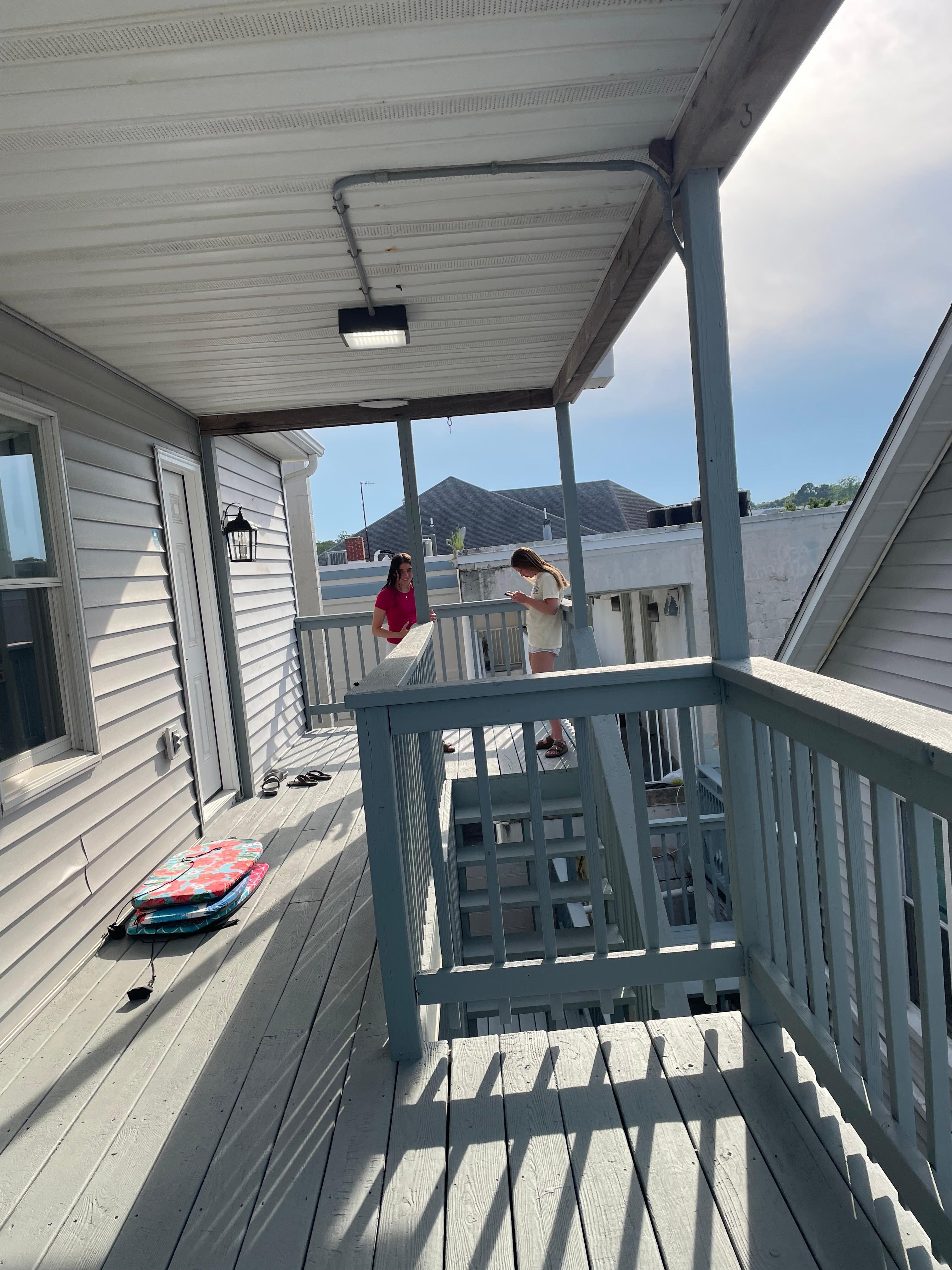 Photo from other side of deck, showing stairs. Deck is larger in person. 