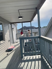 Photo from other side of deck, showing stairs. Deck is larger in person.