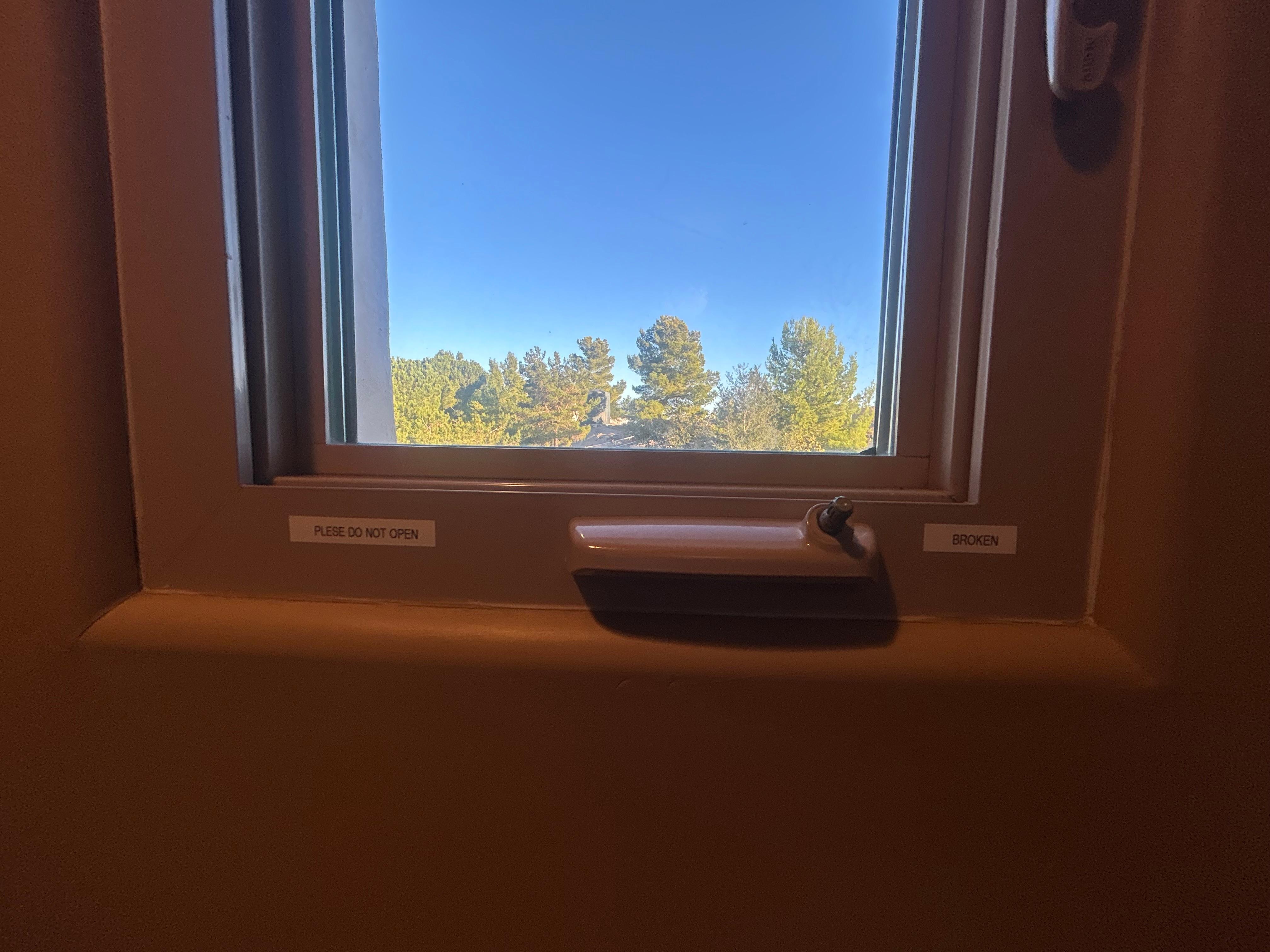 Bathroom windows broken. Note says “ broken don’t open”
