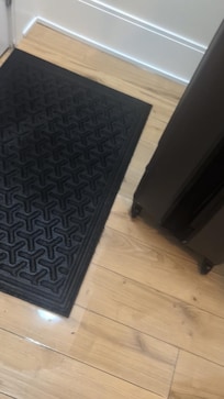 Water pooled near the entrance of the unit upon arrival — no explanation or prior notice provided.