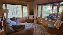 Comfy sitting area with large windows for peaceful views