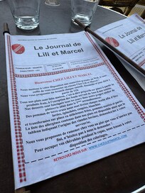 Chez Lili - 1 page of their multi page menu. Burger and crispy salad are terrific.