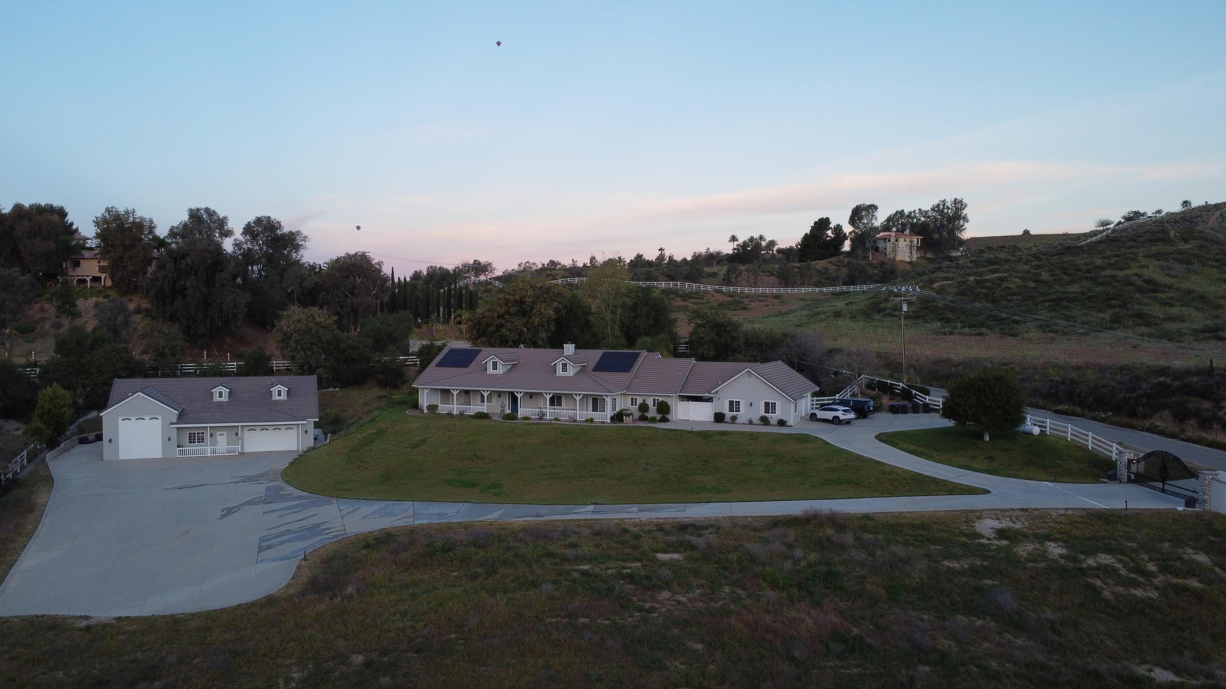 View of the property. Hot air balloons in the background 