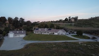 View of the property. Hot air balloons in the background