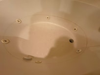 Dirty spa tub in the master bedroom.
