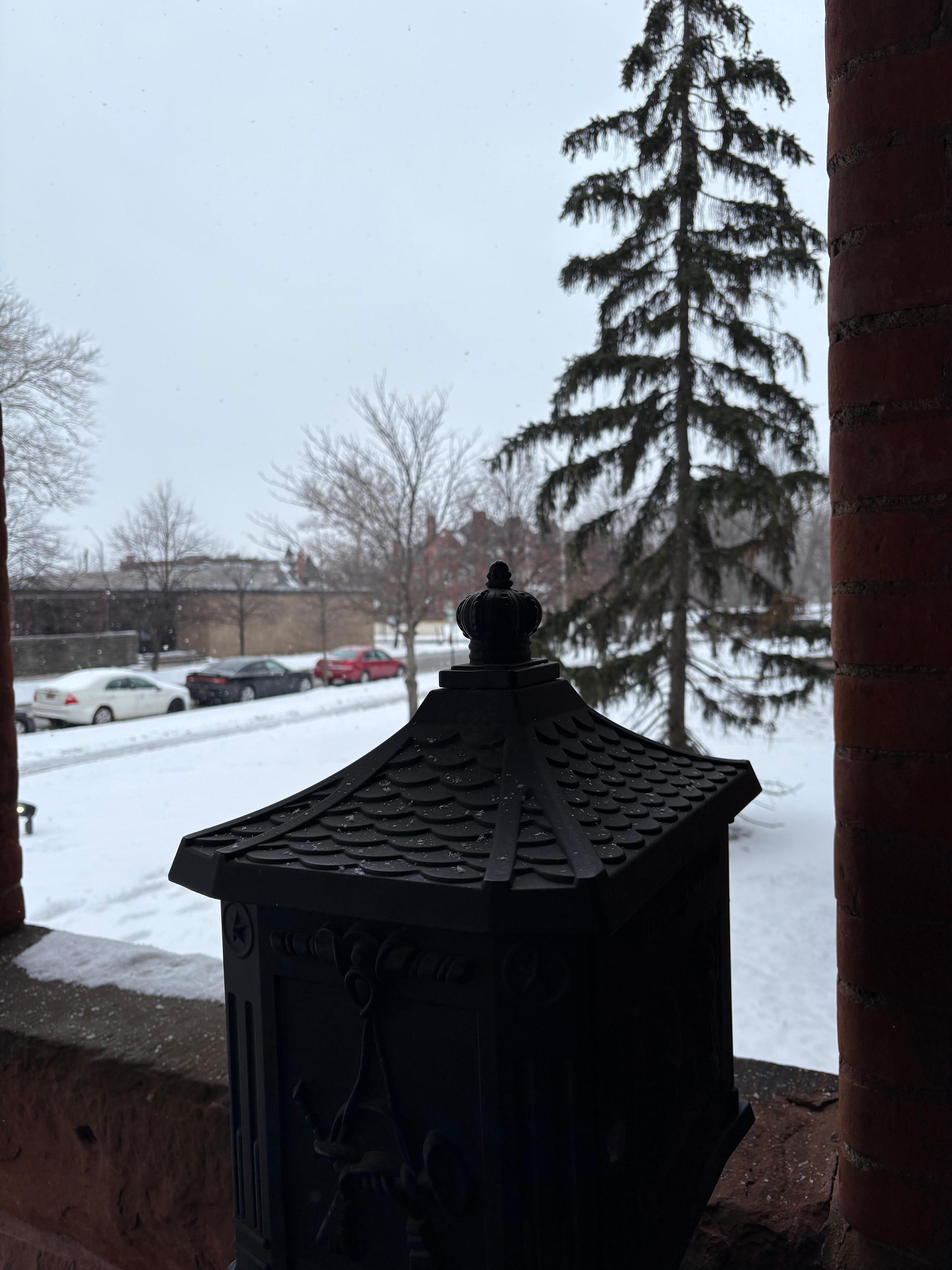 Snowy quiet and quaint entrance that takes you back to a different time. 