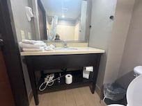 Towel rack and hair dryer just waiting to be put back on the wall I guess