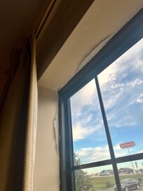 The drywall around the window was cracking