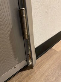 Door frame needs to be repaired. It seems like housekeeping should turn in work order for that