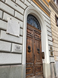 The front door. Inside there are about 6 steps up to the elevator.