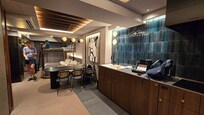 Main room, deluxe with bunkbed, table for six, kitchenette.
