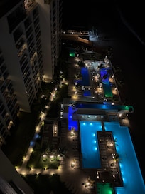 Night time view of pools.