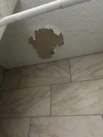 Above the tub.
