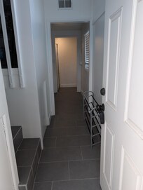 Entryway from driveway goes straight to the top of the stairs.