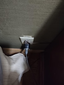 Electrical outlet pulled out of the wall.